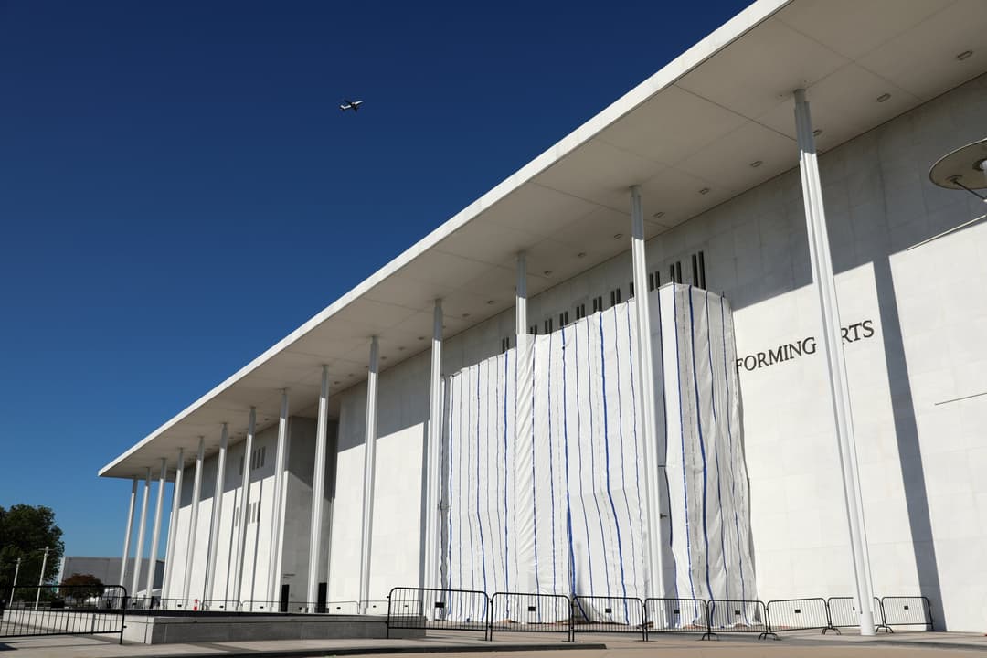 PHOTOS: What’s under the tarp? Kennedy Center facade covered after Trump’s name removed - WTOP
